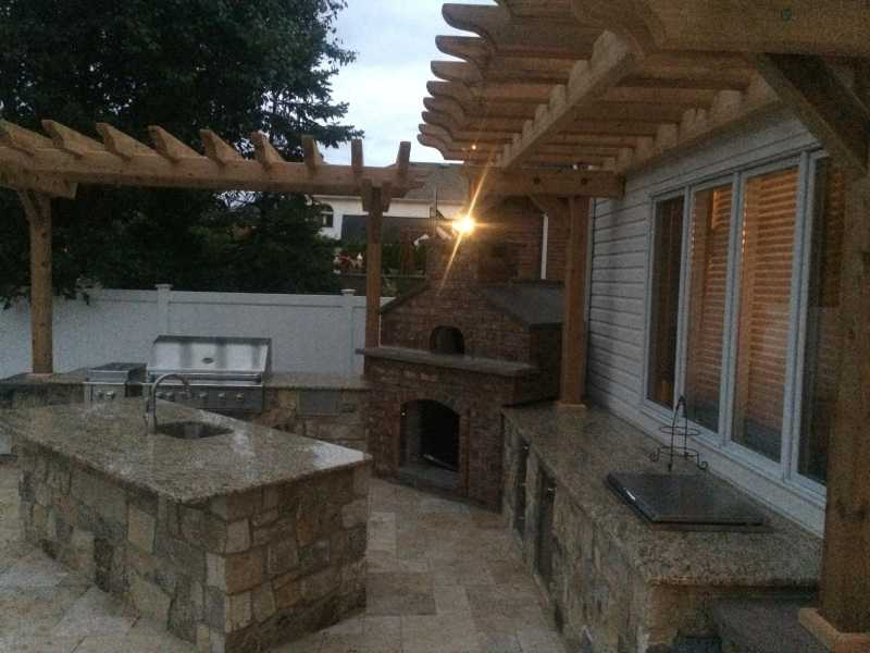 Backyard Kitchen With Custom Brick Fireplace