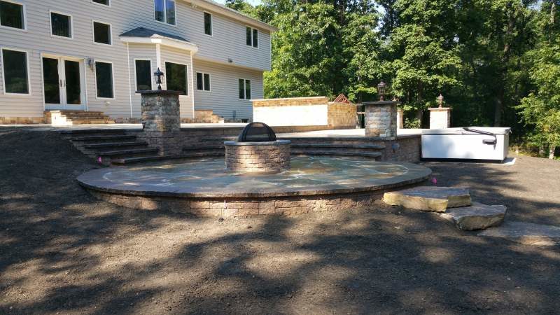 Custom Fire Pit and Raised Patio Design