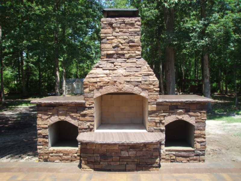 Custom Outdoor Fireplace by Millenium Stone Works