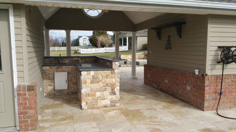 Custom Outdoor Kitchen with Stonework Layout