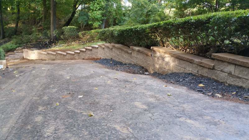 Driveway with Retaining Wall by Millenium Stone Works
