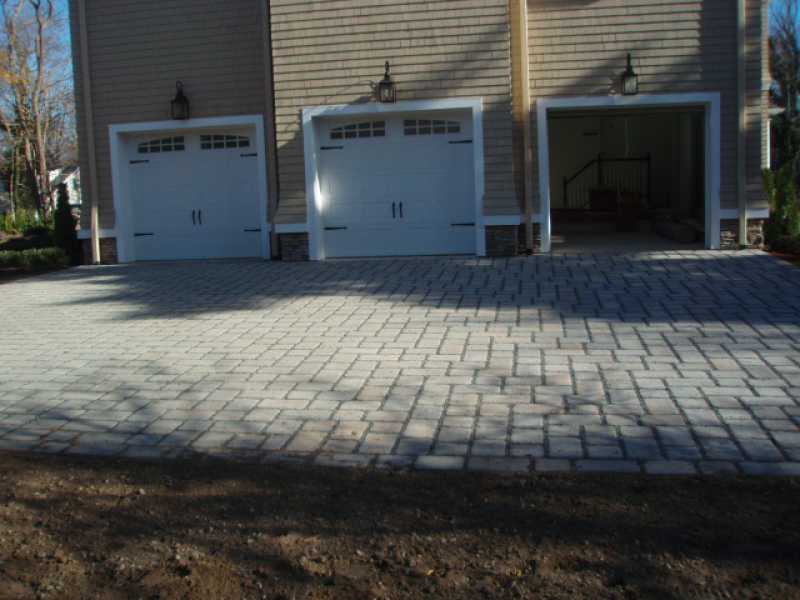 Garage with Custom Paver Driveway by Millenium Stone Works