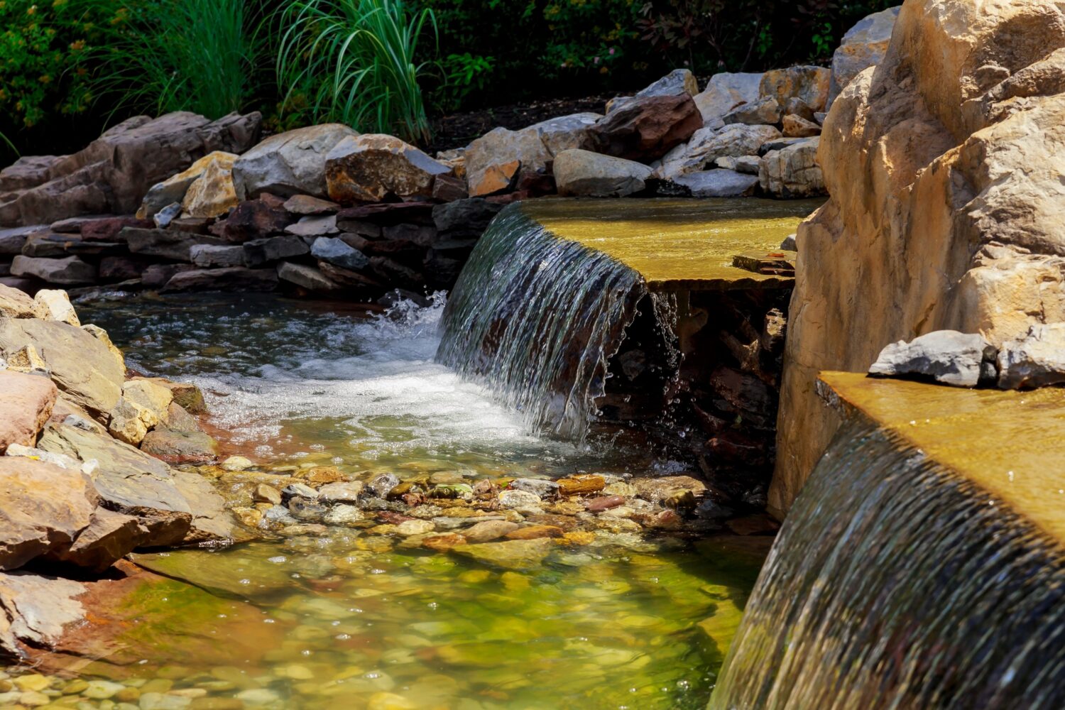 Modern hardscape design with integrated backyard water feature