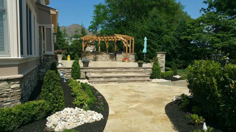 Millenium Stoneworks Custom Raised Patio and Pergola