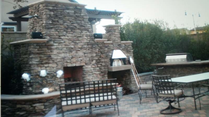 Outdoor Entertainment with Custom Fireplace and Kitchen