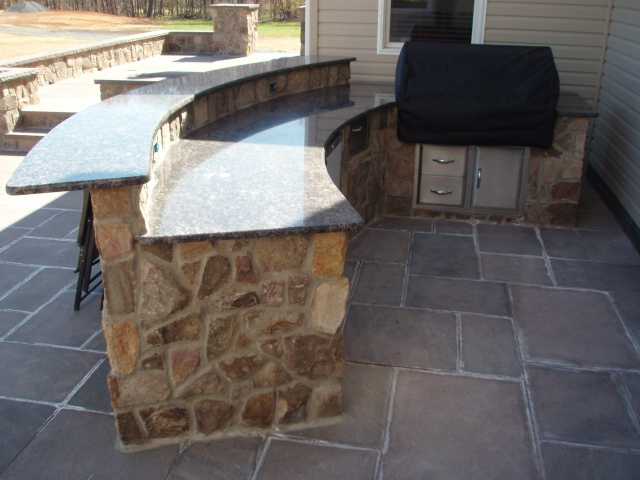 Outdoor Kitchen with Custom Stone Design