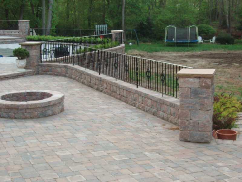 Raised Patio with Backyard and Fire Pit
